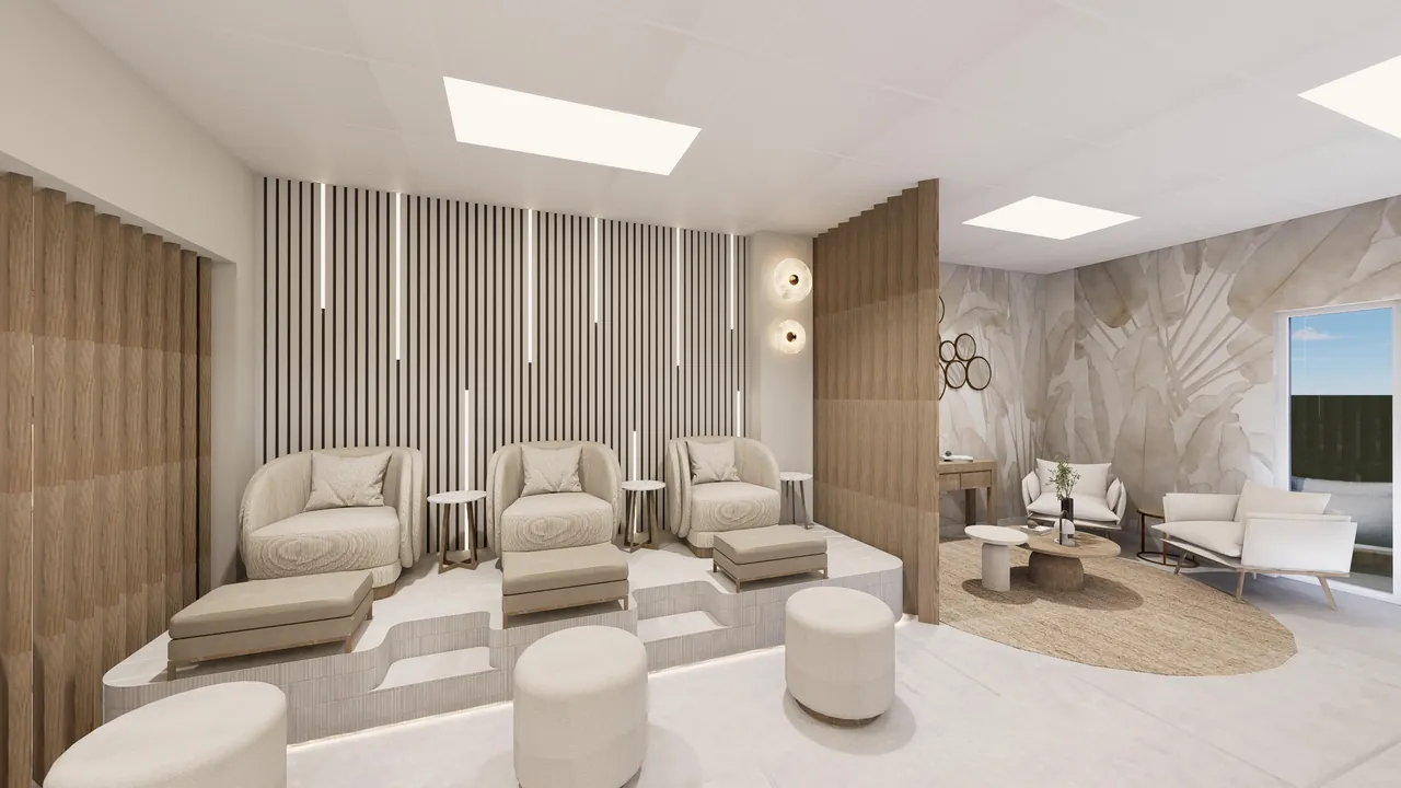 Lounge seating inside NKW Beauty Studio with warm neutral finishes and soft lighting