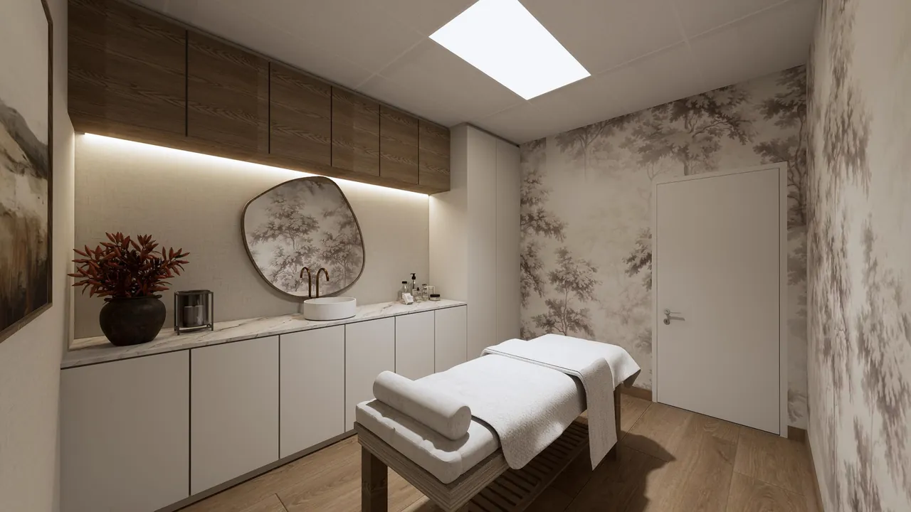 Private spa treatment room with a massage bed and warm built-in cabinetry